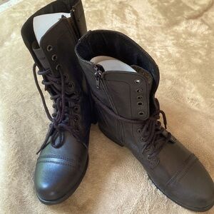 Steve Madden “Troopa” black leather combat boot.